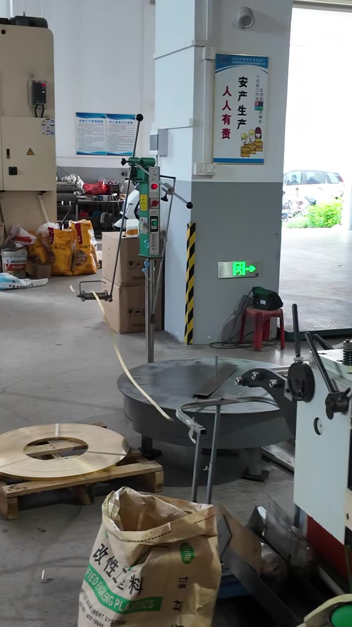 Stamping machine running brass strip in the workshop