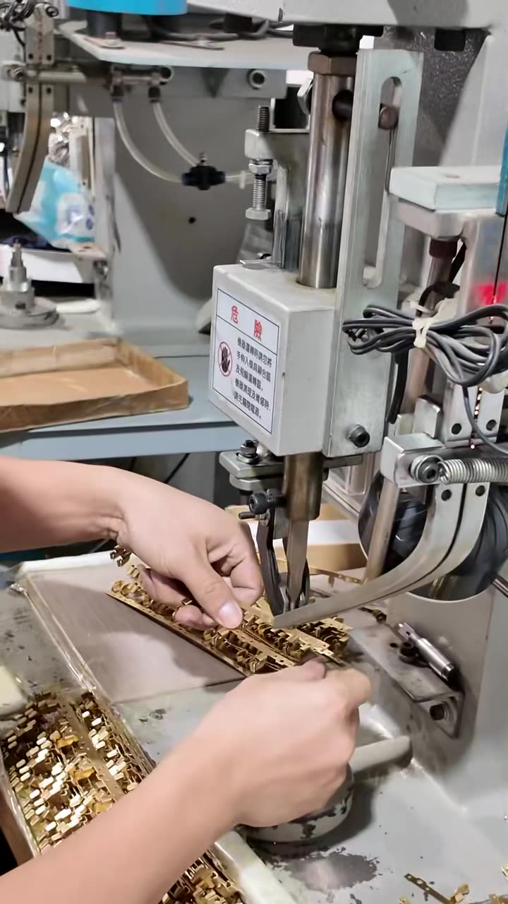 Operator setting up a stamping machine