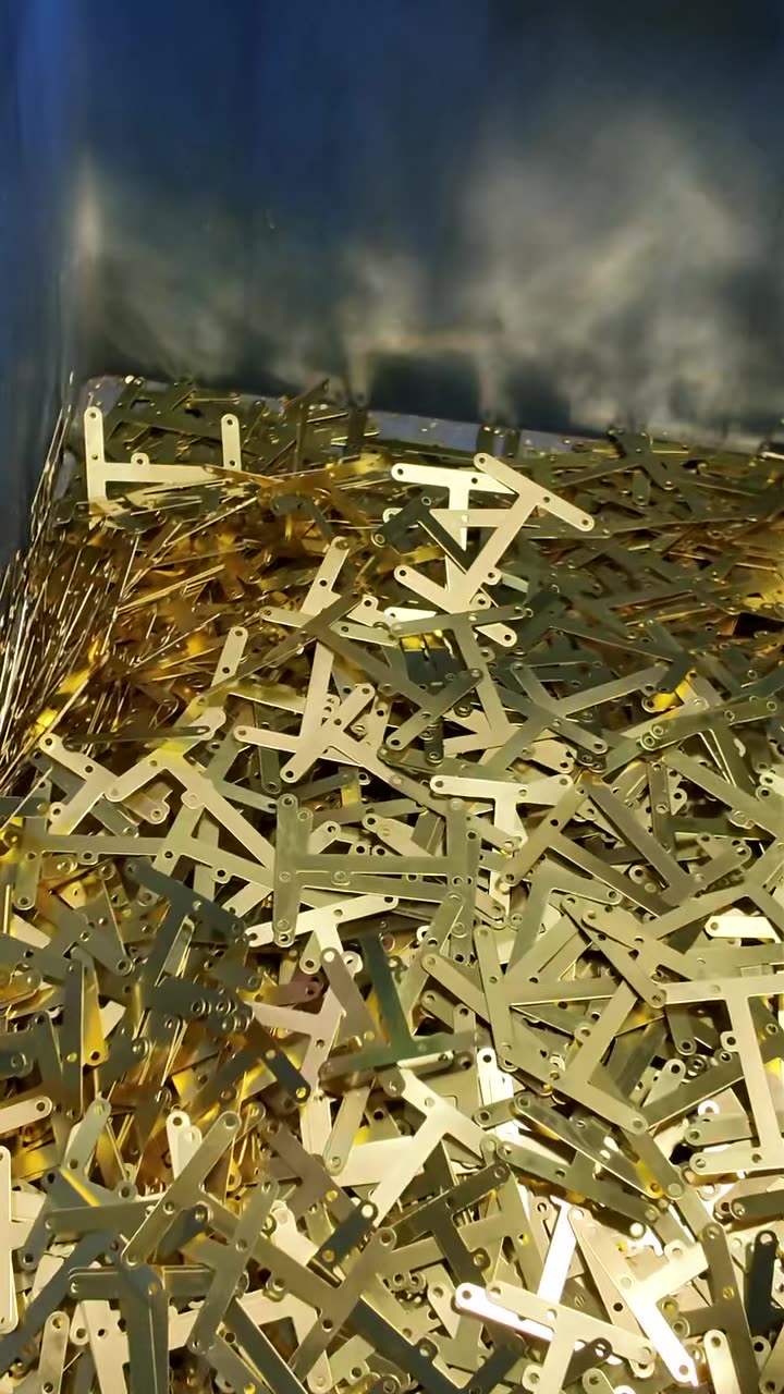 Formed brass strip parts stacked after stamping